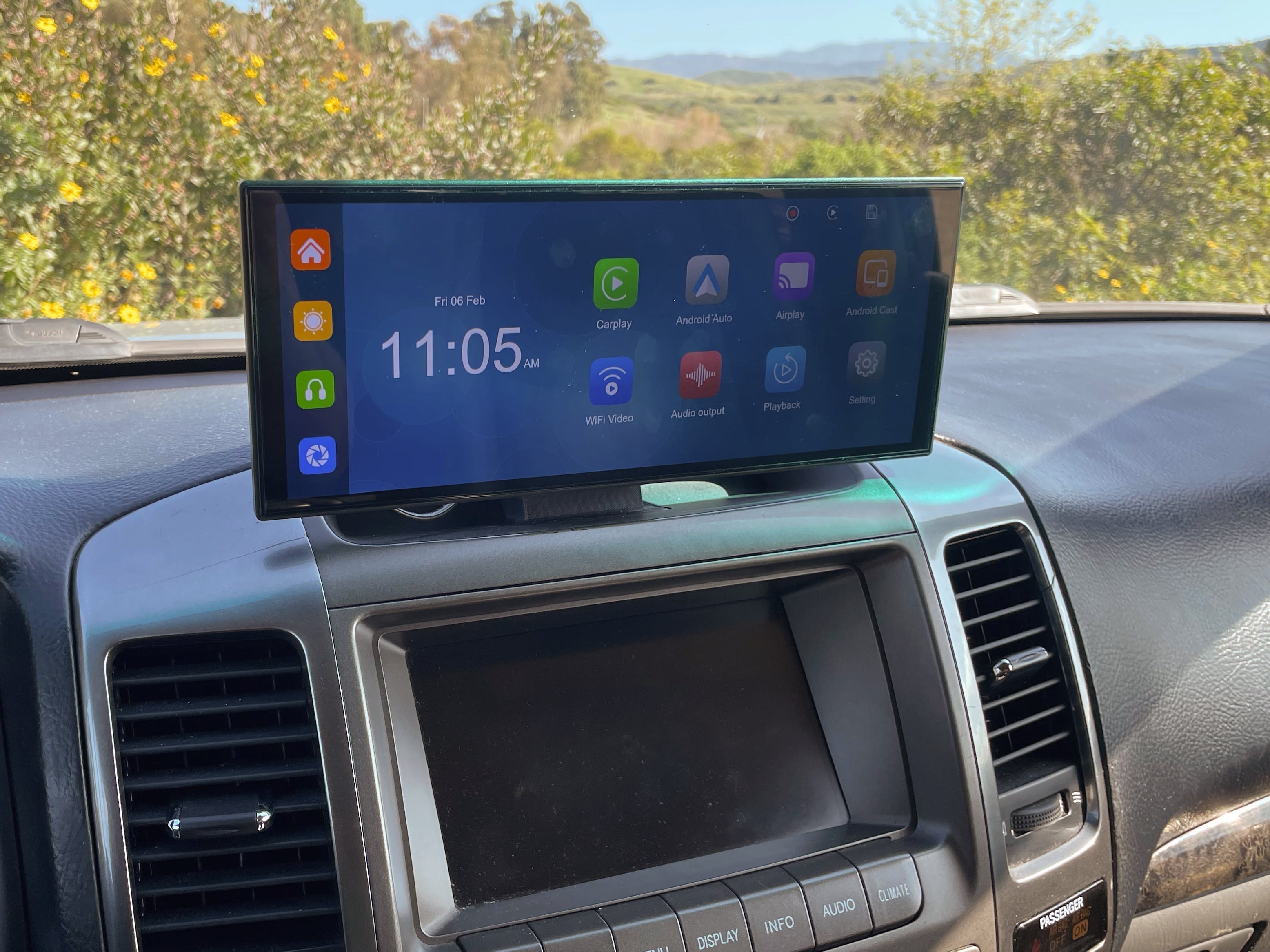 Carplay screen mounted in vehicle displaying a carplay options