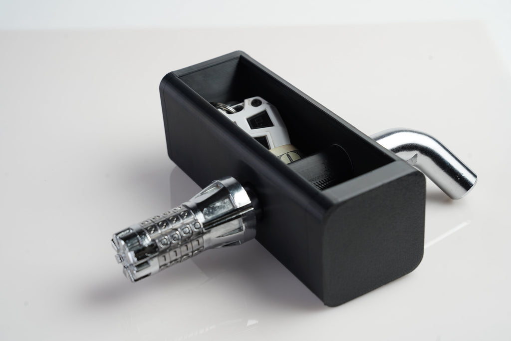 Image showing hitch stash with sample contents and a combination lock hitch pin. The lock hitch pin is not included.