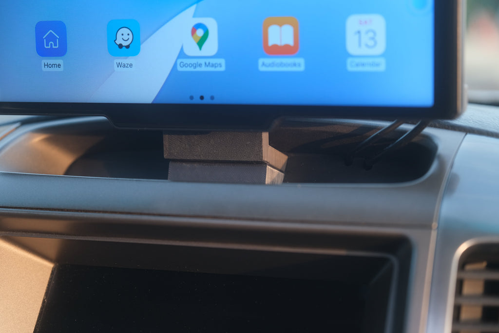 Closeup view of a carplay mount installed in the vehicle