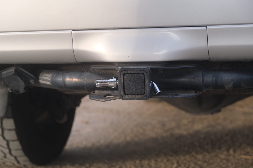 Image showing hitch stash in the closed position. Displayed with a combination lock hitch pin that is not included.
